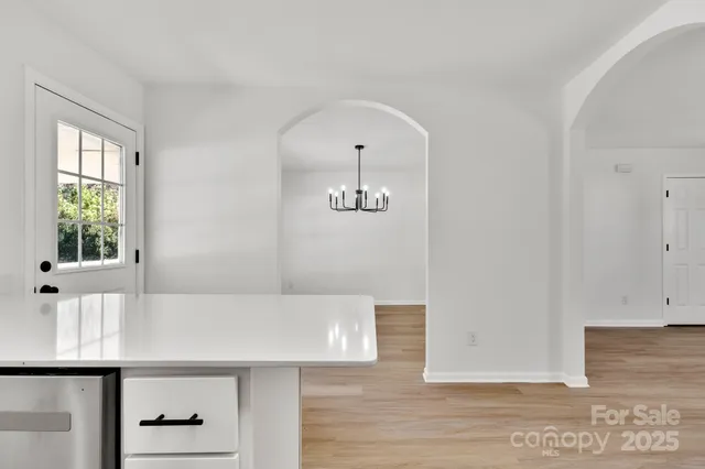 a view of an entryway with wooden floor