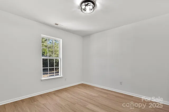 an empty room with window