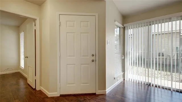 a view of entryway with wooden floor