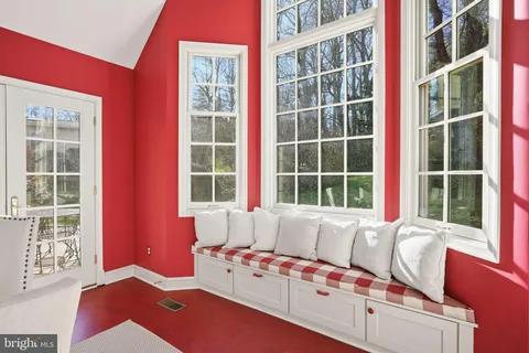 a living room with furniture and windows