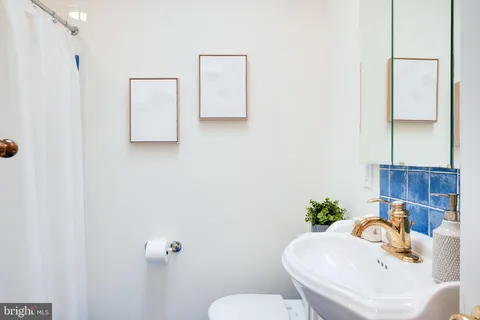 a bathroom with a sink and a toilet
