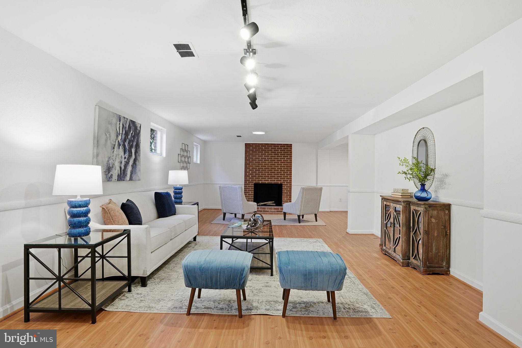 8200 Beech Tree Road Bethesda, MD 20817 - Photo 19 of 29 a living room with furniture and a flat screen tv
