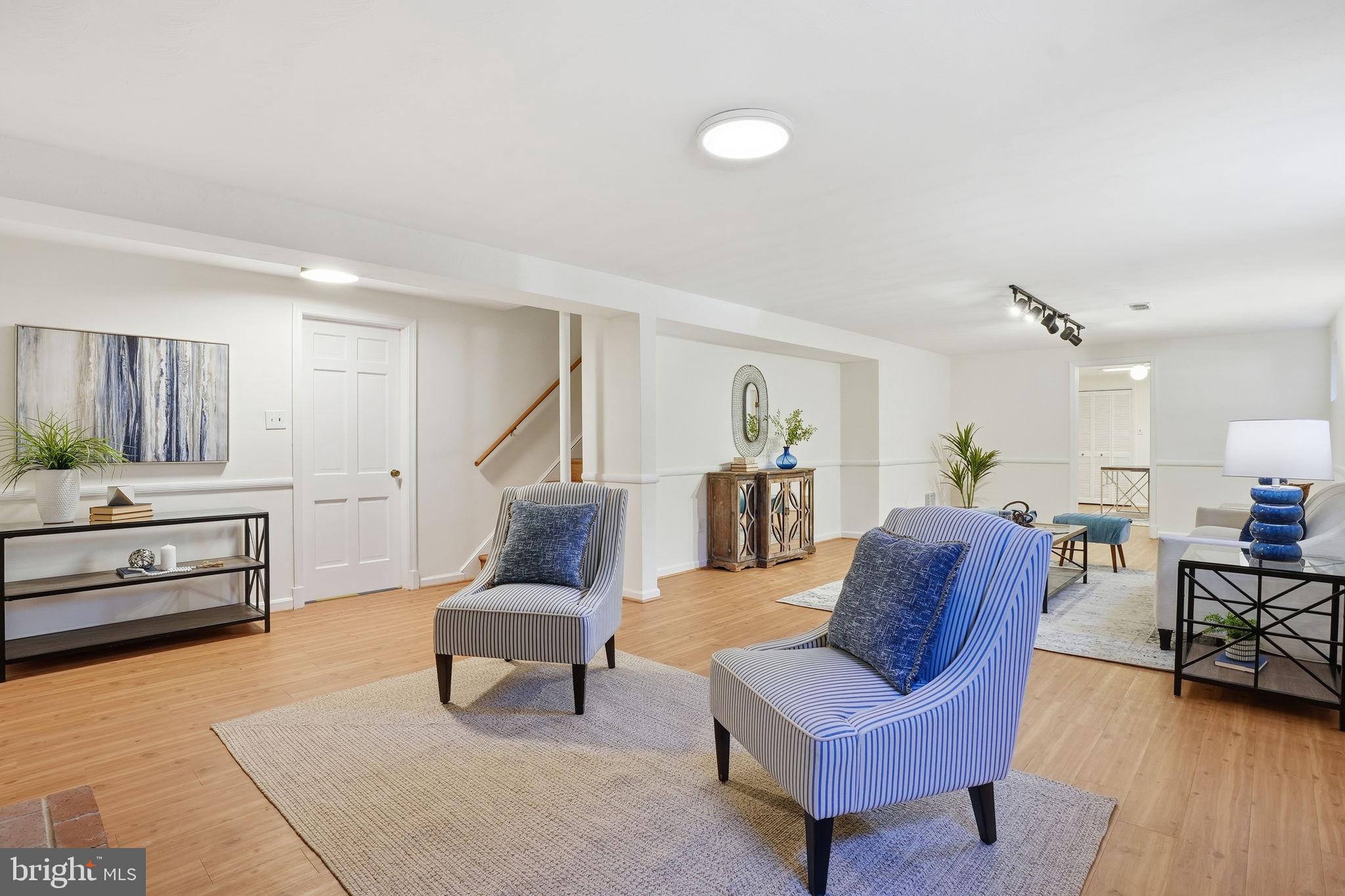 8200 Beech Tree Road Bethesda, MD 20817 - Photo 20 of 29 a living room with furniture and a wooden floor