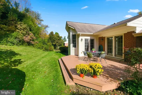 a view of an house with backyard porch and furniture