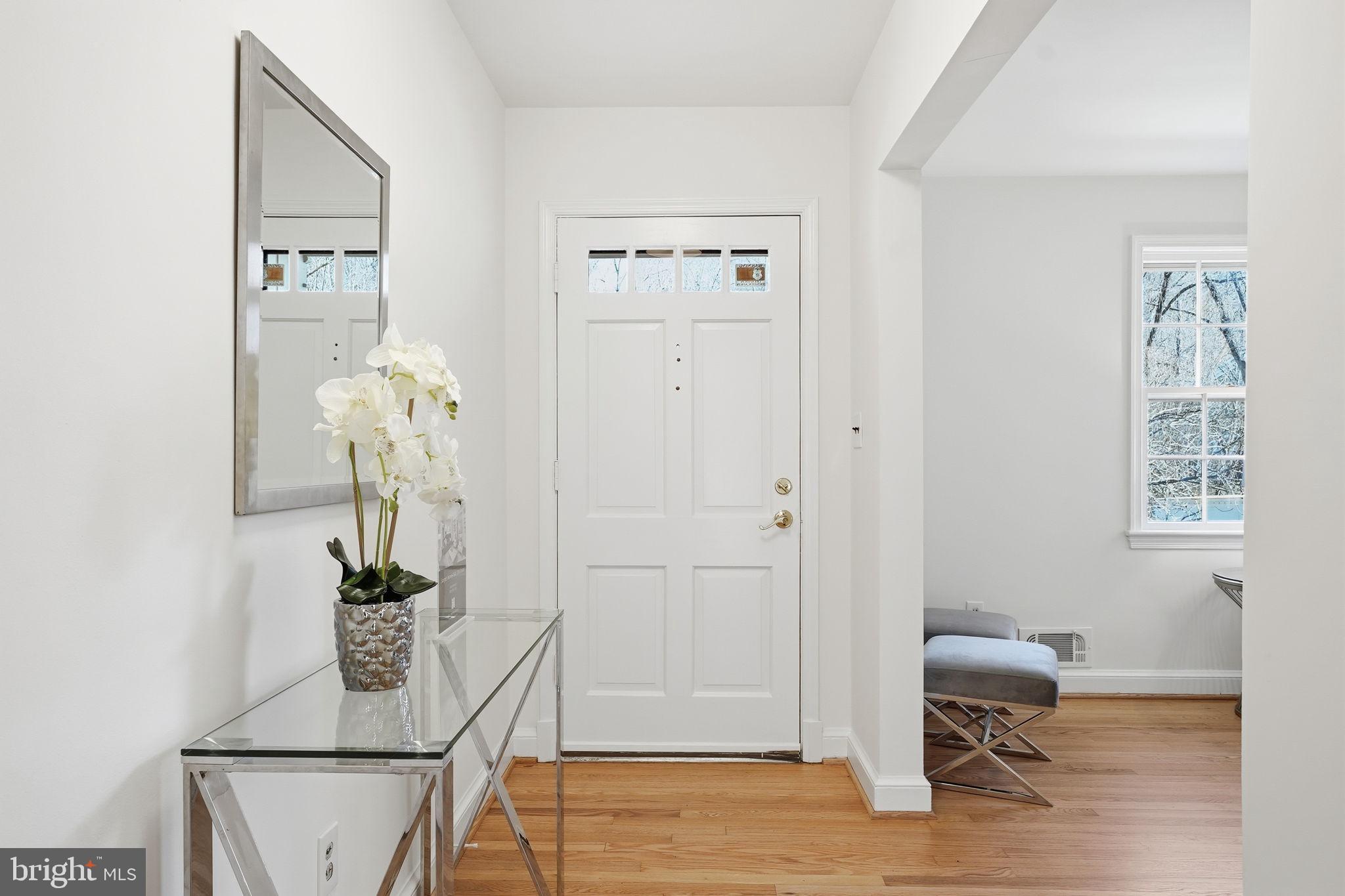 8200 Beech Tree Road Bethesda, MD 20817 - Photo 3 of 29 a view of hall way with furniture and wooden floor