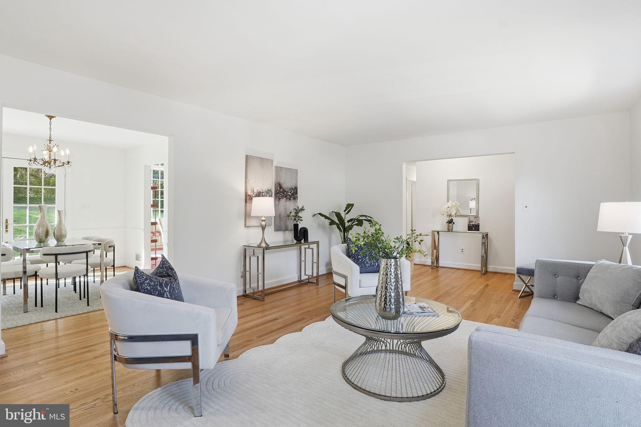 8200 Beech Tree Road Bethesda, MD 20817 - Photo 6 of 29 a living room with furniture a dining table and chairs