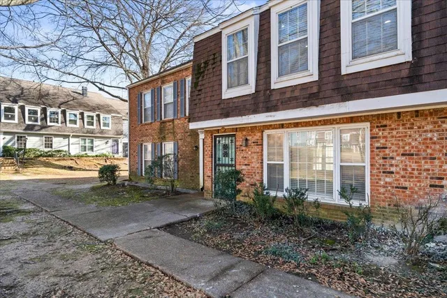 a view of a building with a yard