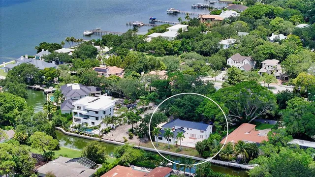 an aerial view of residential house with outdoor space and swimming pool