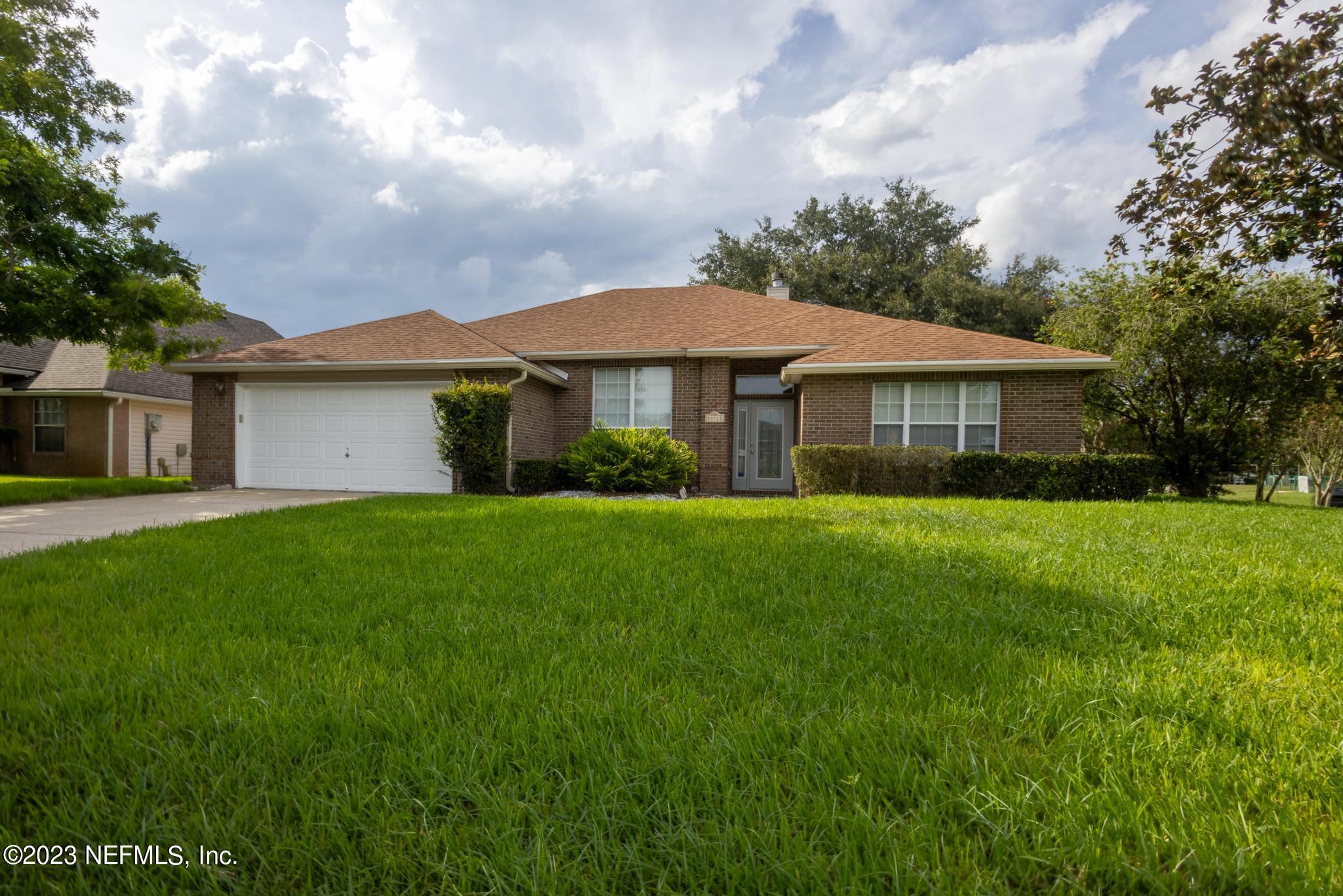 10321 Sugar Grove Road Jacksonville, FL 32221 - Photo 1 of 34 a view of a house with a yard