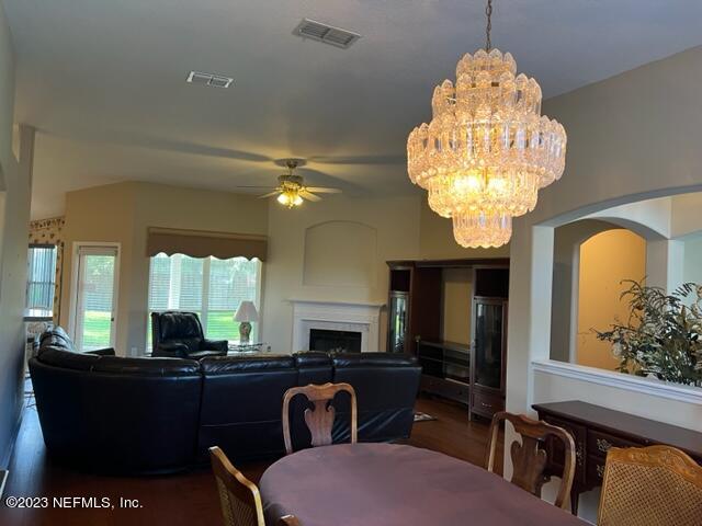 10321 Sugar Grove Road Jacksonville, FL 32221 - Photo 13 of 34 a view of a room with furniture and chandelier