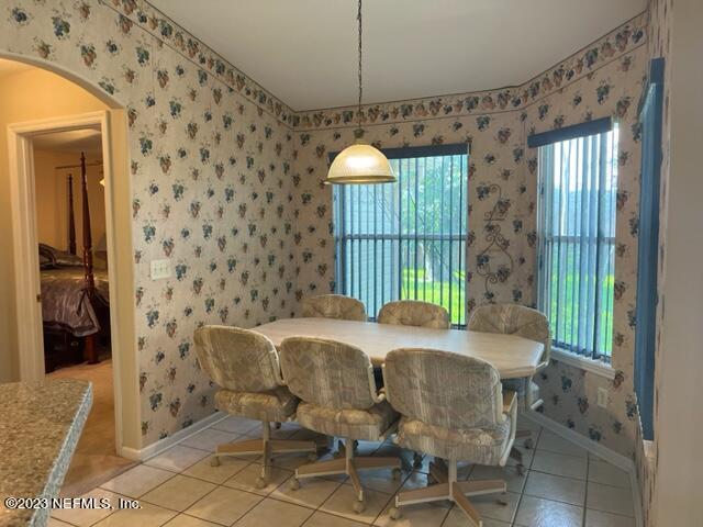 10321 Sugar Grove Road Jacksonville, FL 32221 - Photo 18 of 34 a dining room with furniture and window