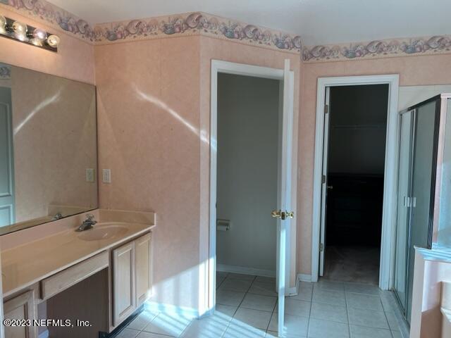 10321 Sugar Grove Road Jacksonville, FL 32221 - Photo 24 of 34 a bathroom with a sink and a mirror