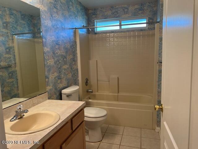10321 Sugar Grove Road Jacksonville, FL 32221 - Photo 26 of 34 a bathroom with a granite countertop sink toilet and shower