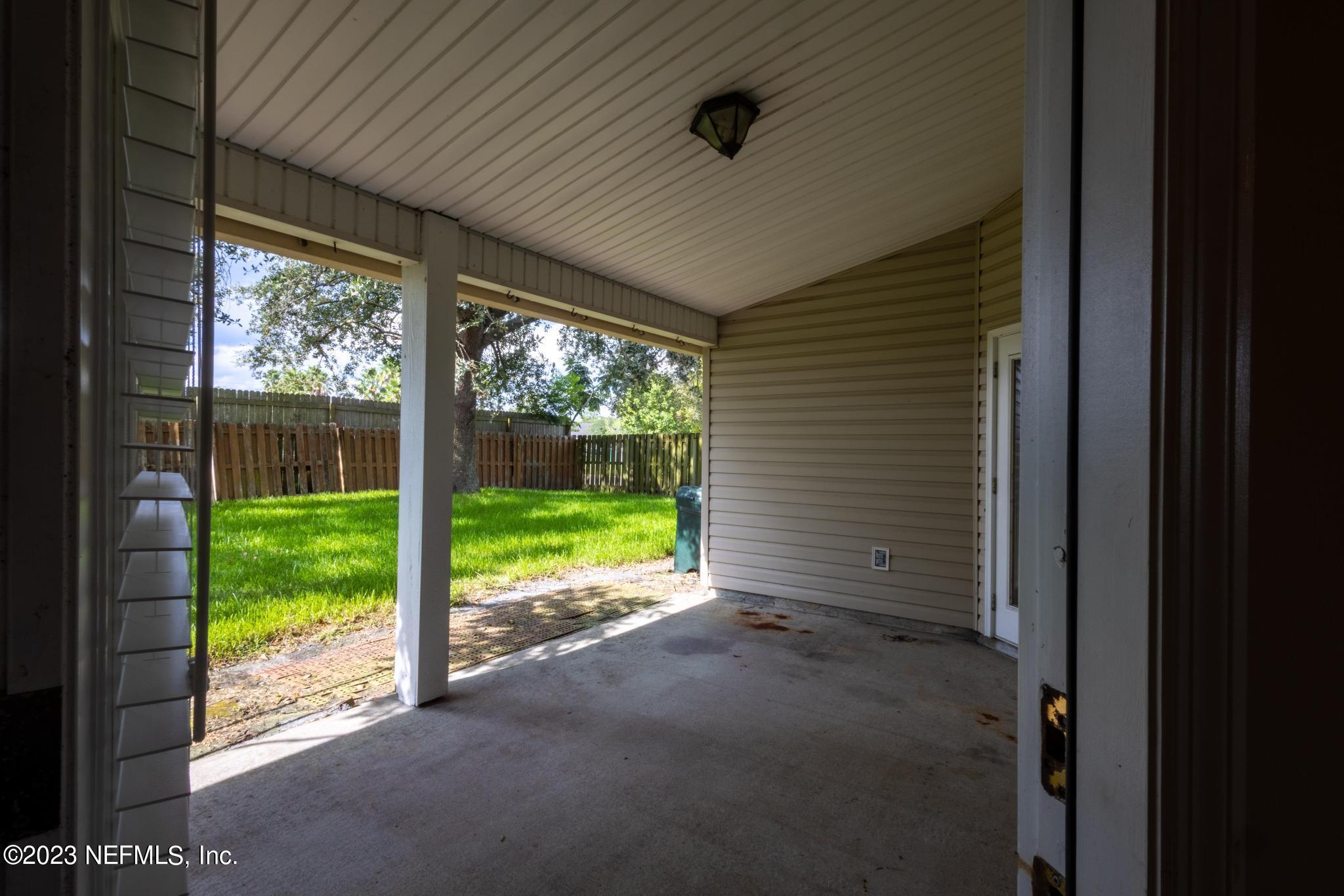 10321 Sugar Grove Road Jacksonville, FL 32221 - Photo 28 of 34 a view of a room with yard and balcony