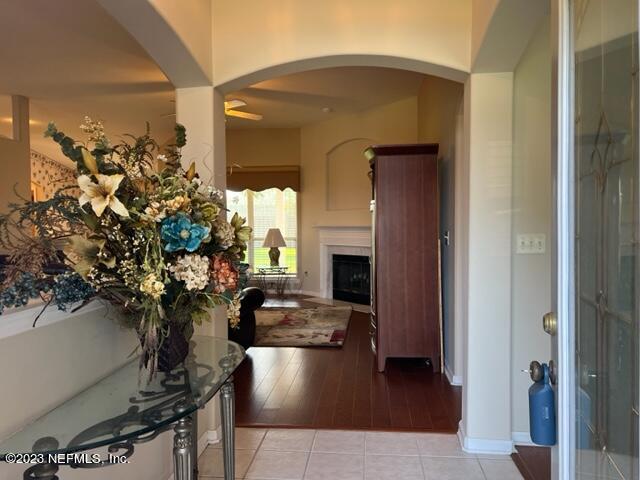 10321 Sugar Grove Road Jacksonville, FL 32221 - Photo 6 of 34 a living room with furniture and a fireplace