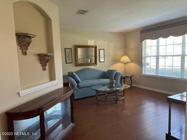10321 Sugar Grove Road Jacksonville, FL 32221 - Photo 7 of 34 a living room with furniture and a window