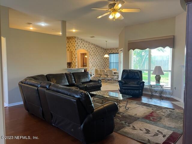 10321 Sugar Grove Road Jacksonville, FL 32221 - Photo 8 of 34 a living room with furniture and a large window