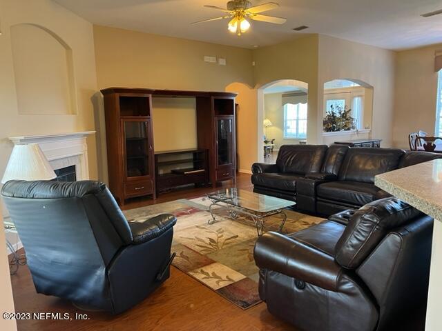 10321 Sugar Grove Road Jacksonville, FL 32221 - Photo 9 of 34 a living room with furniture and a flat screen tv