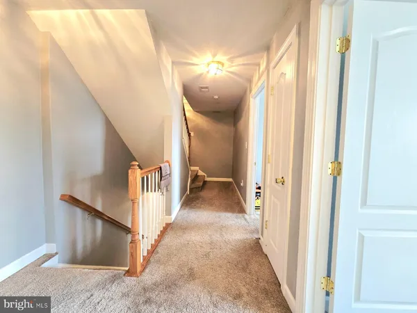 a view of a hallway view with staircase