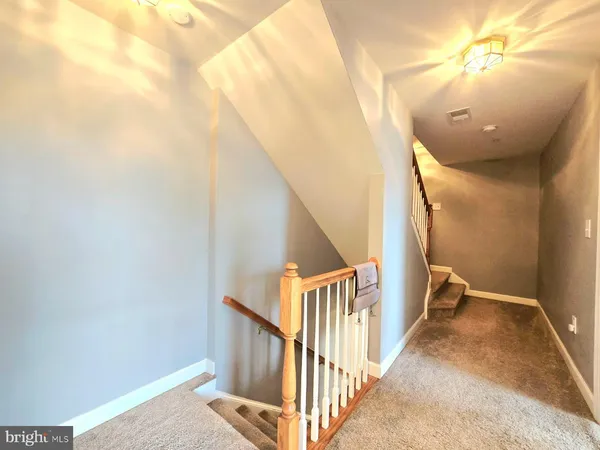 a view of a hallway with staircase