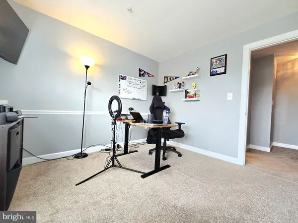 a view of a workspace with furniture