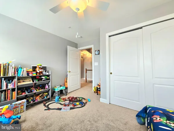 a play room with toys and a couch