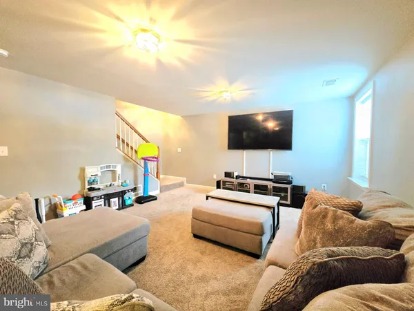a bathroom with a sink mirror and toilet