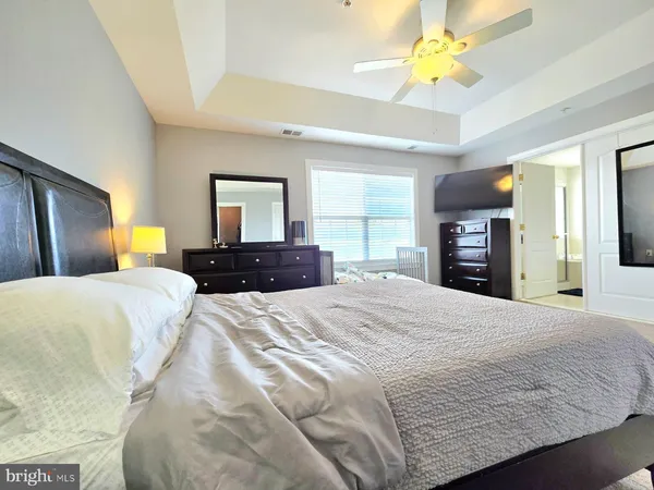 a bedroom with a bed and a dresser