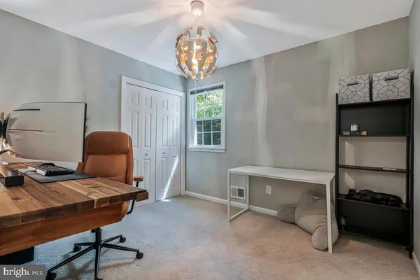 a workspace with furniture and window