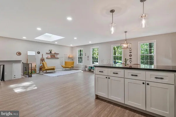 a view of a kitchen with furniture and window
