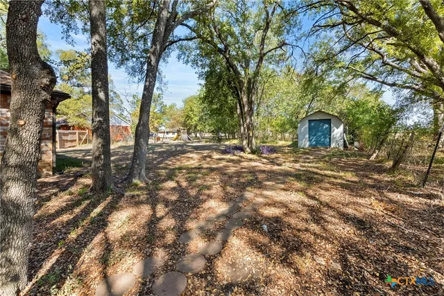 a backyard of a house with lots of green space