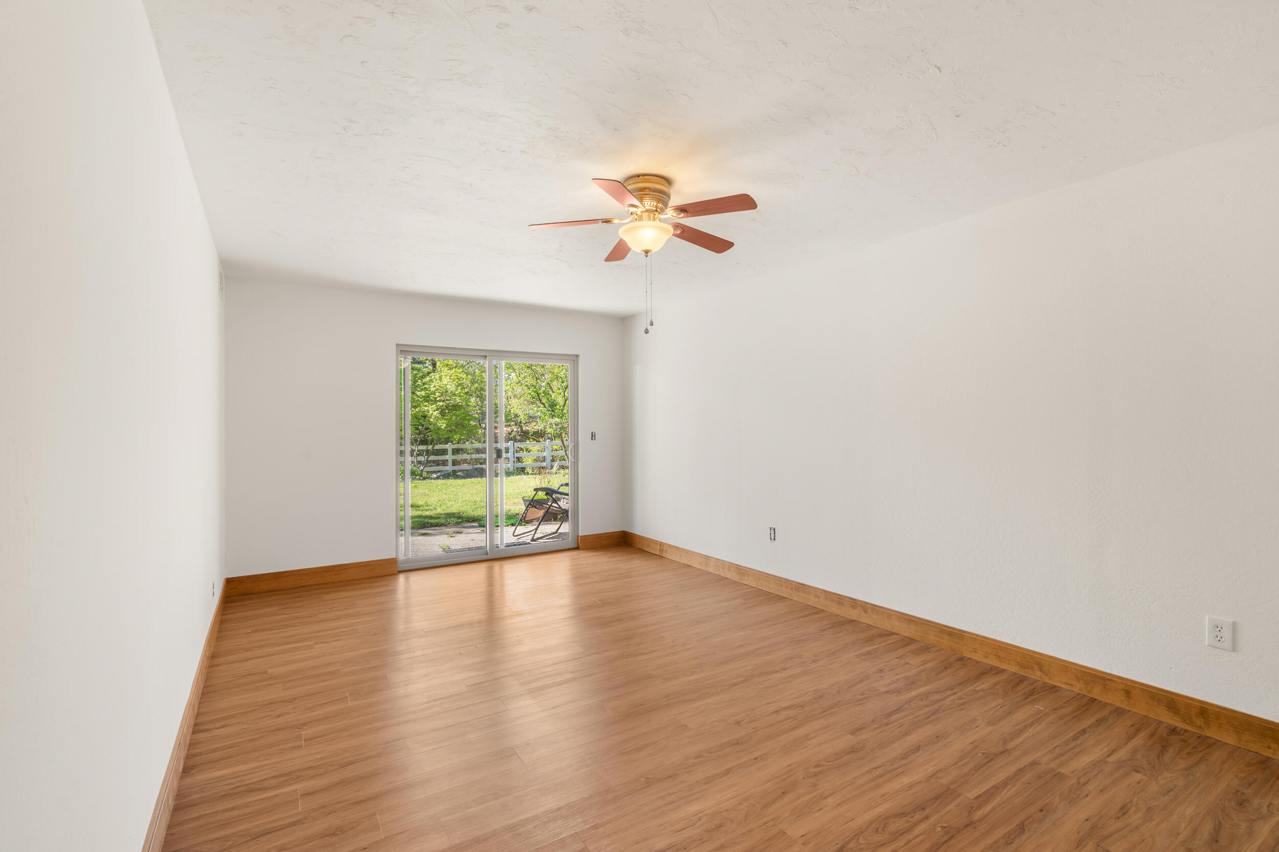 3583 Ross Lane Central Point, OR 97502 - Photo 23 of 52 wooden floor in an empty room with a window