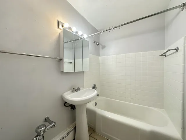 a bathroom with a sink and shower