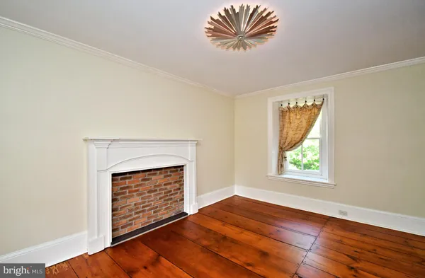 a bed room with a bed and a mirror