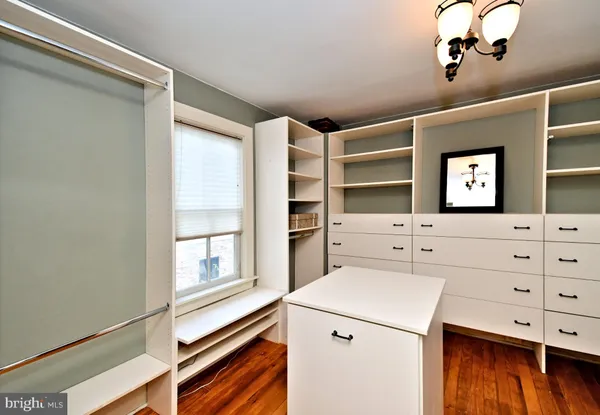 a view of an empty room with wooden walls