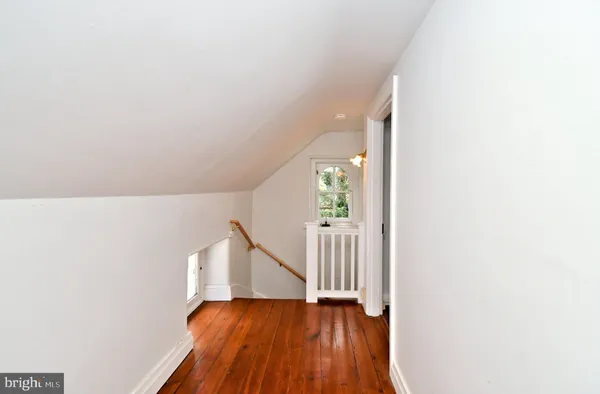 a view of a chair and table in a garden