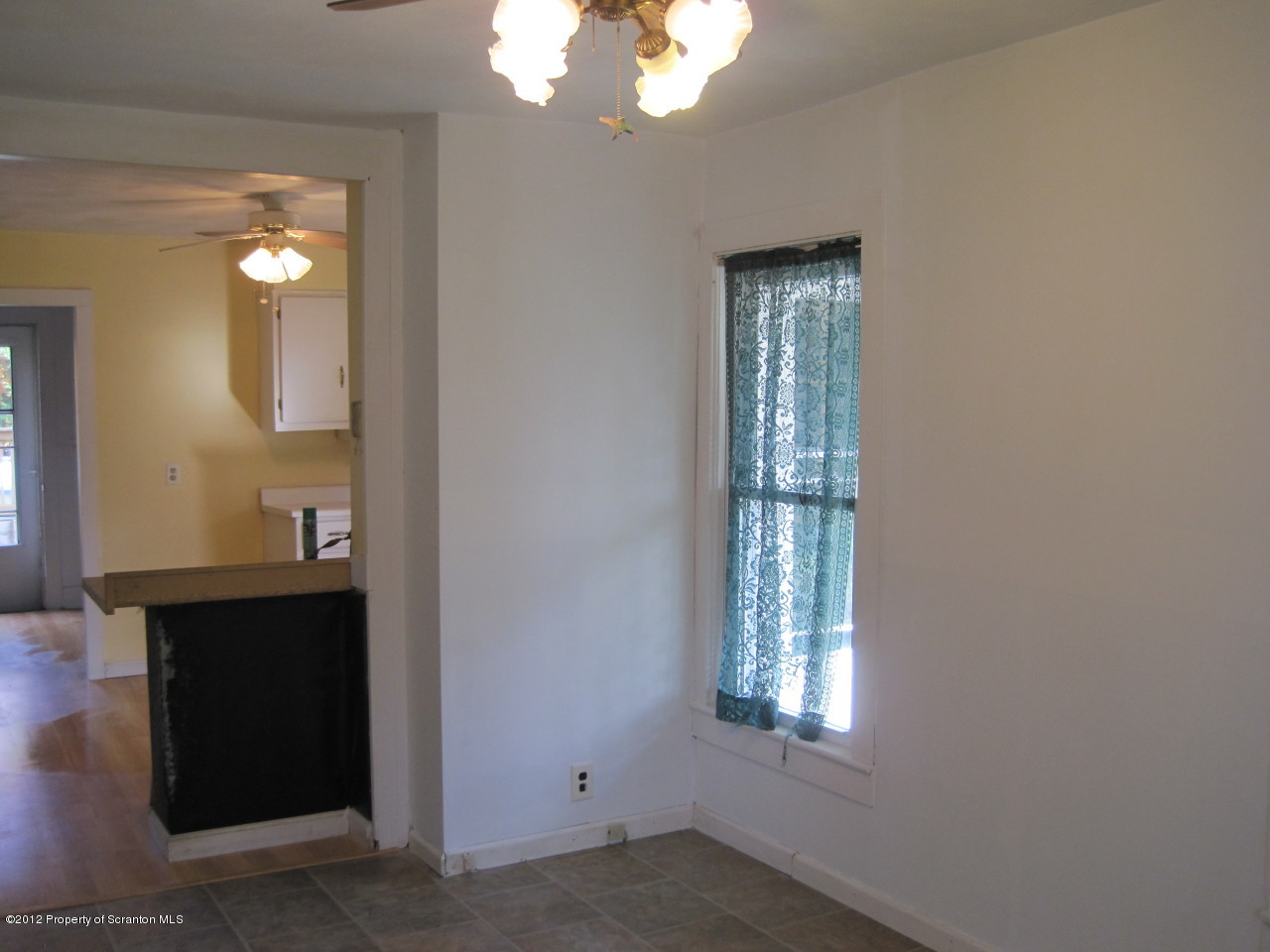 234 Orchard Road Great Bend, PA 18821 - Photo 13 of 21 a view of an empty room with wooden floor and a window