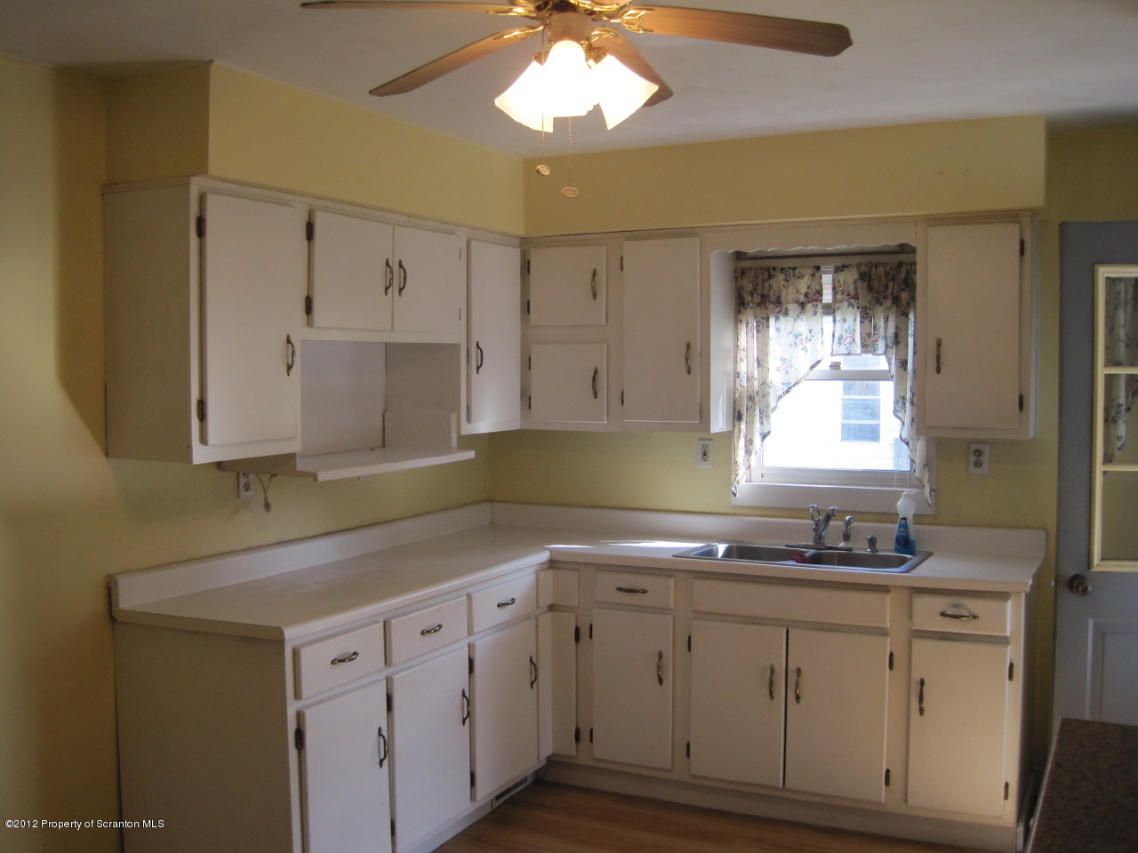 234 Orchard Road Great Bend, PA 18821 - Photo 17 of 21 a kitchen with granite countertop white cabinets white stainless steel appliances and a window