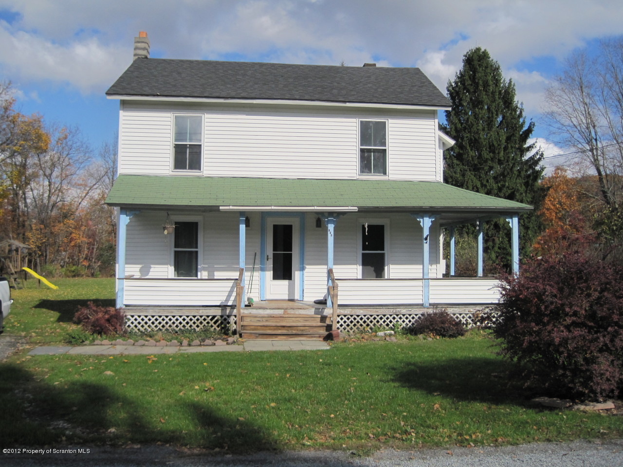 234 Orchard Road Great Bend, PA 18821 - Photo 21 of 21 a front view of a house with a garden