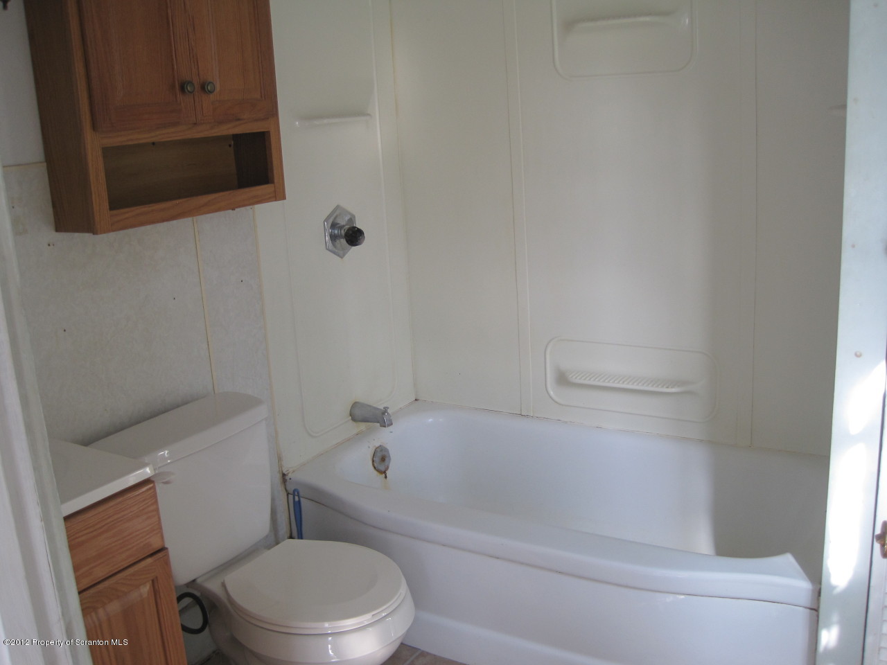 234 Orchard Road Great Bend, PA 18821 - Photo 10 of 21 a white bath tub sitting next to a toilet