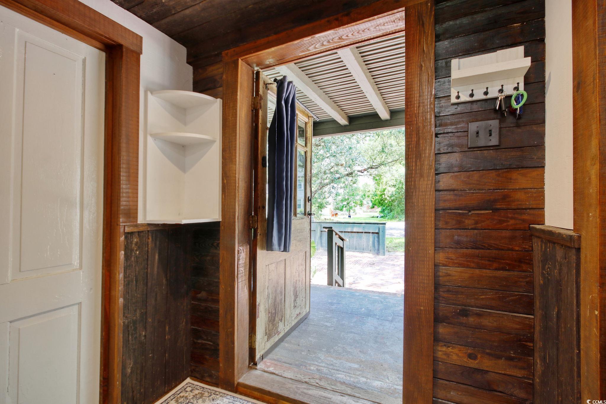 325 Orange Street Georgetown, SC 29440 - Photo 5 of 26 Entryway with wooden ceiling and wood walls