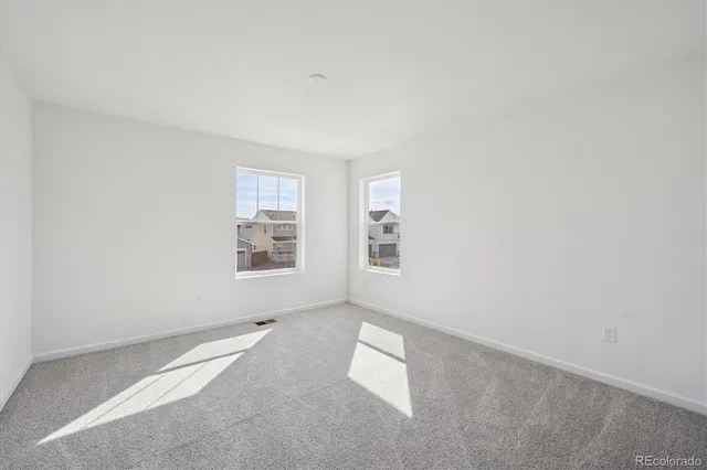 an empty room with windows