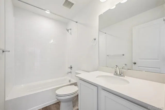 a bathroom with a sink a toilet and a bathtub