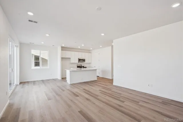 a view of kitchen with wooden floor