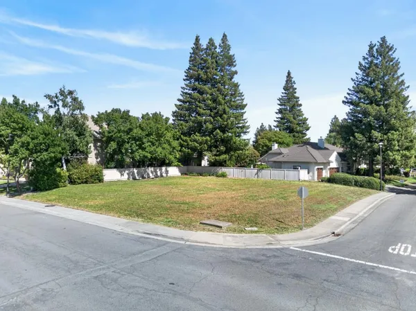 a view of a house with a yard and garage