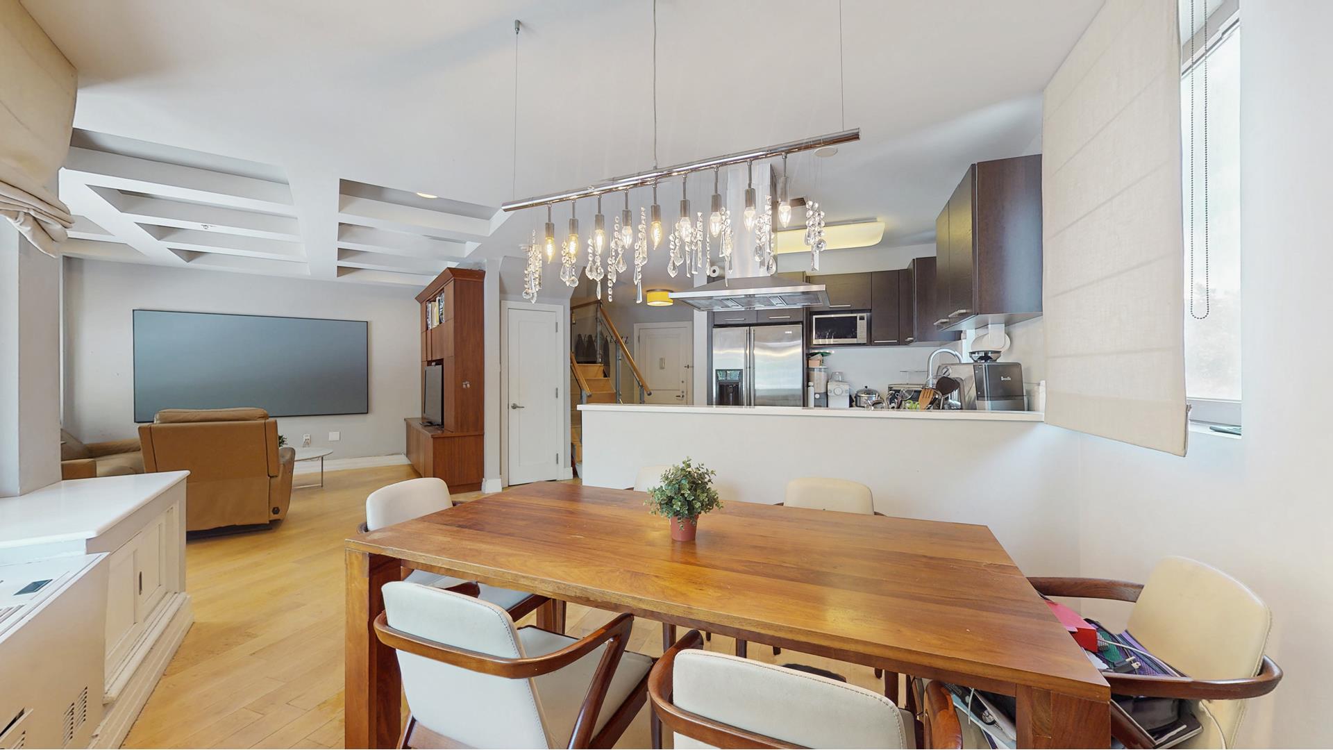 64-05 Yellowstone Boulevard, Unit TH105 Queens, NY 11375 - Photo 1 of 25 a view of a dining room with furniture