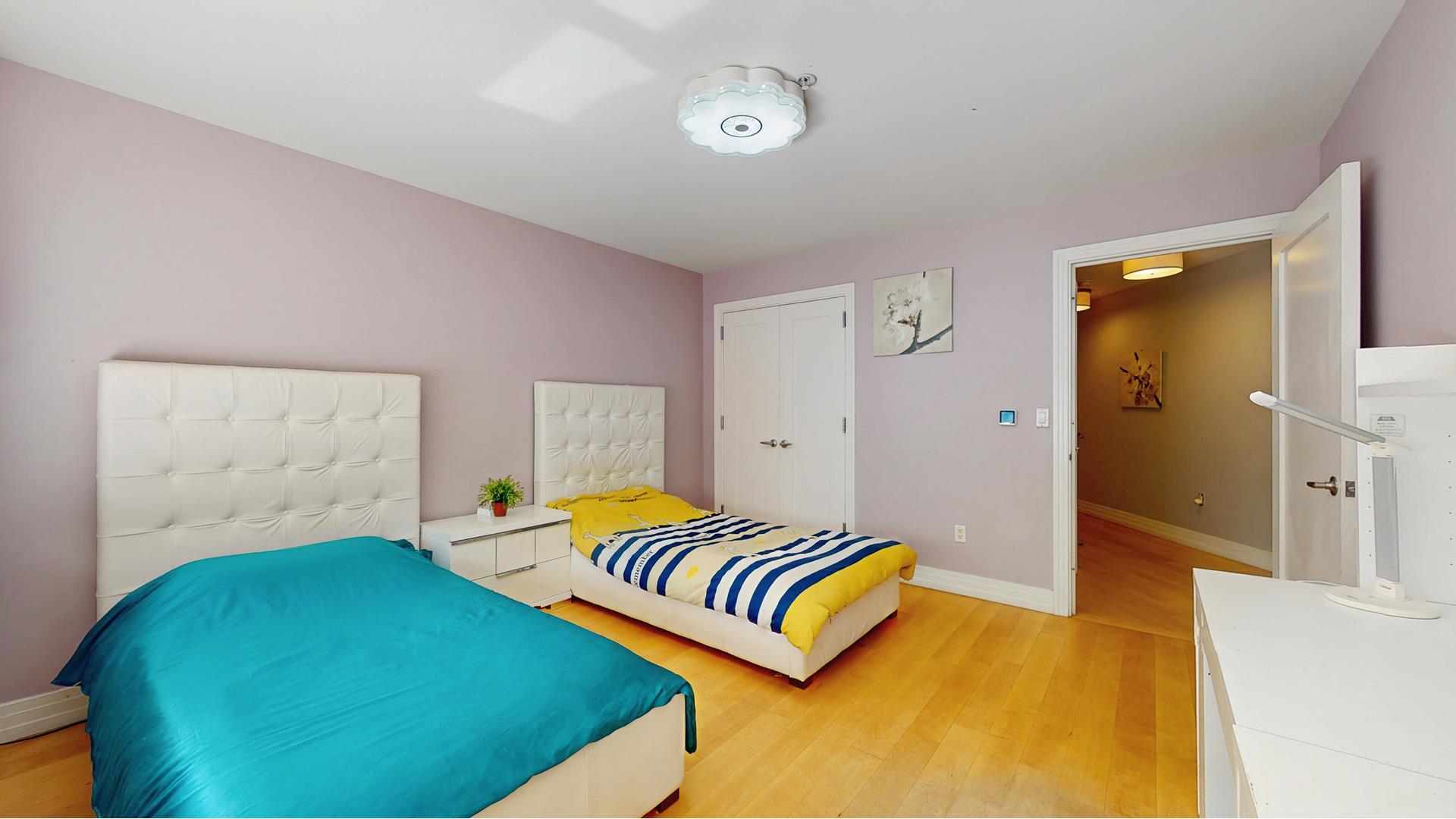 64-05 Yellowstone Boulevard, Unit TH105 Queens, NY 11375 - Photo 10 of 25 a bedroom with a bed and a couch