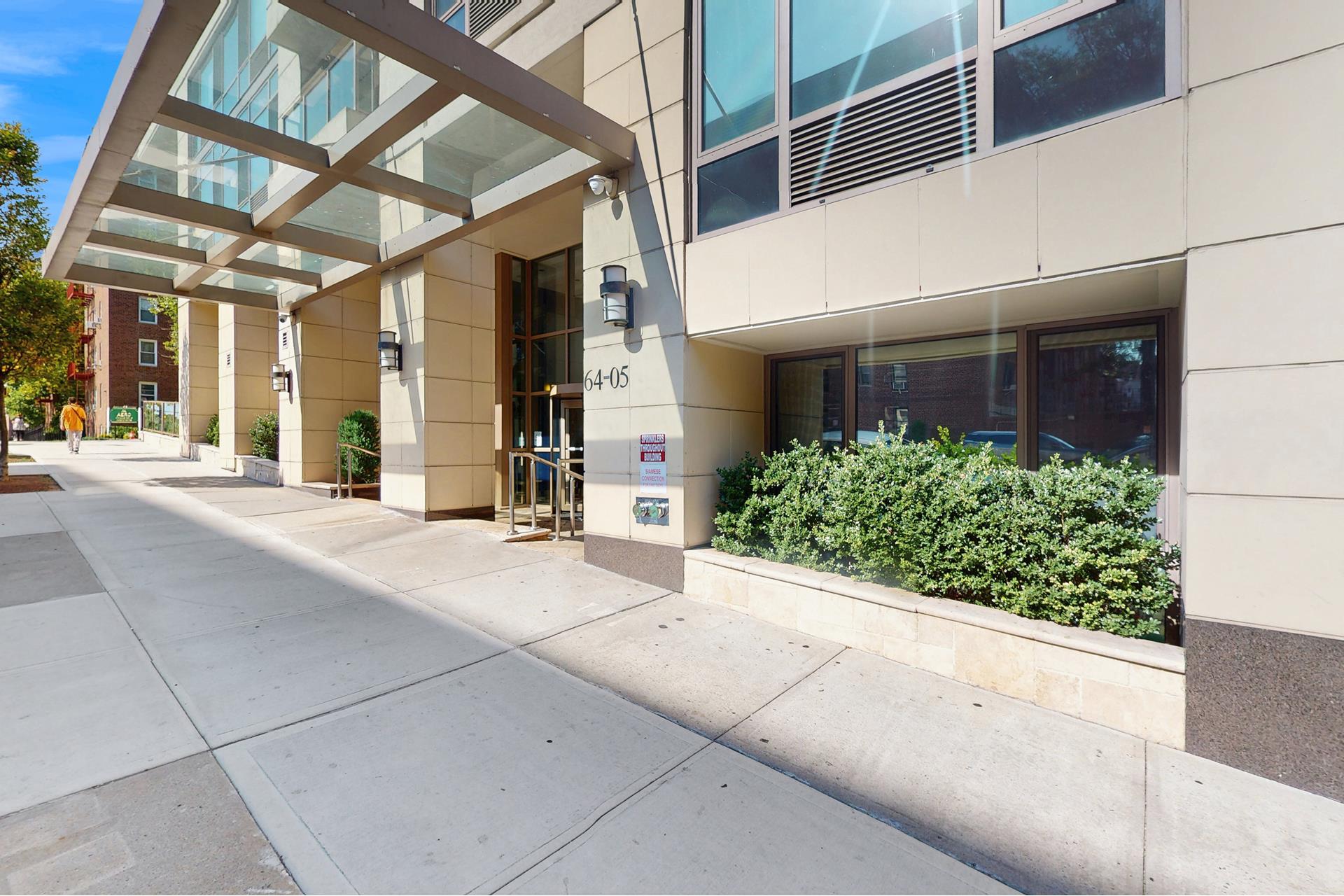 64-05 Yellowstone Boulevard, Unit TH105 Queens, NY 11375 - Photo 11 of 25 a view of a building with porch