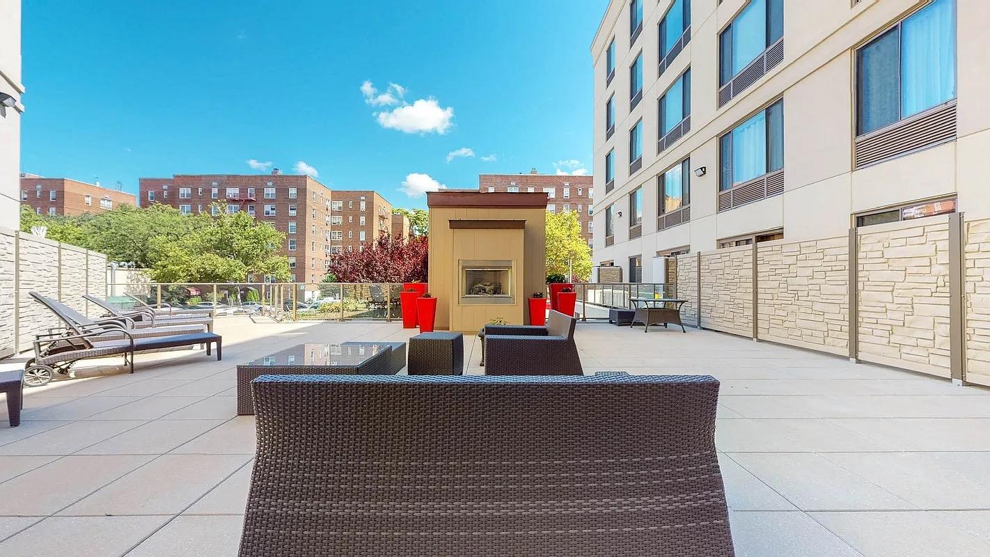 64-05 Yellowstone Boulevard, Unit TH105 Queens, NY 11375 - Photo 14 of 25 a view of a building with sitting area