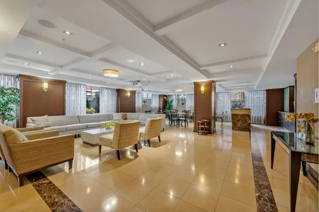a kitchen with a sink and wooden floor